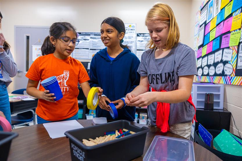 Students do a pumpkin STEM challenge
